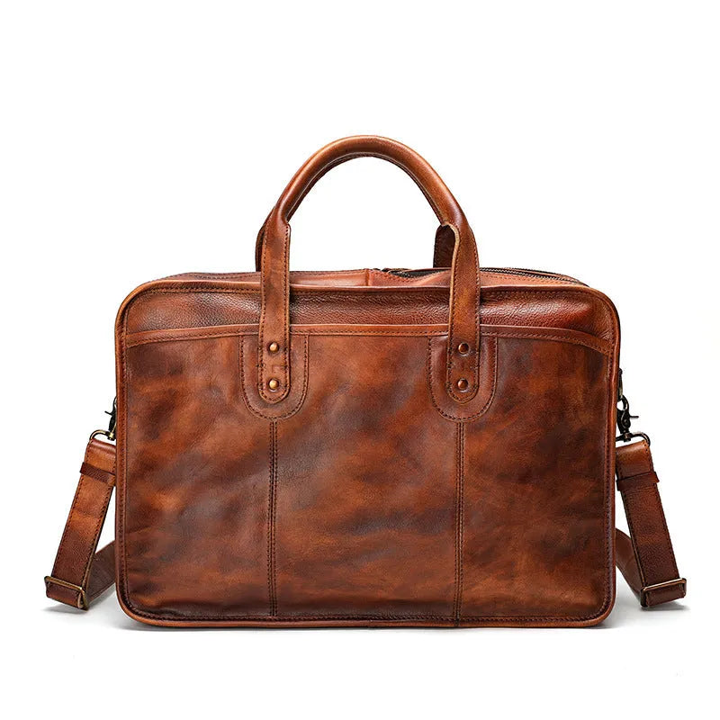 Brown vintage leather men's briefcase showing internal laptop and document pockets