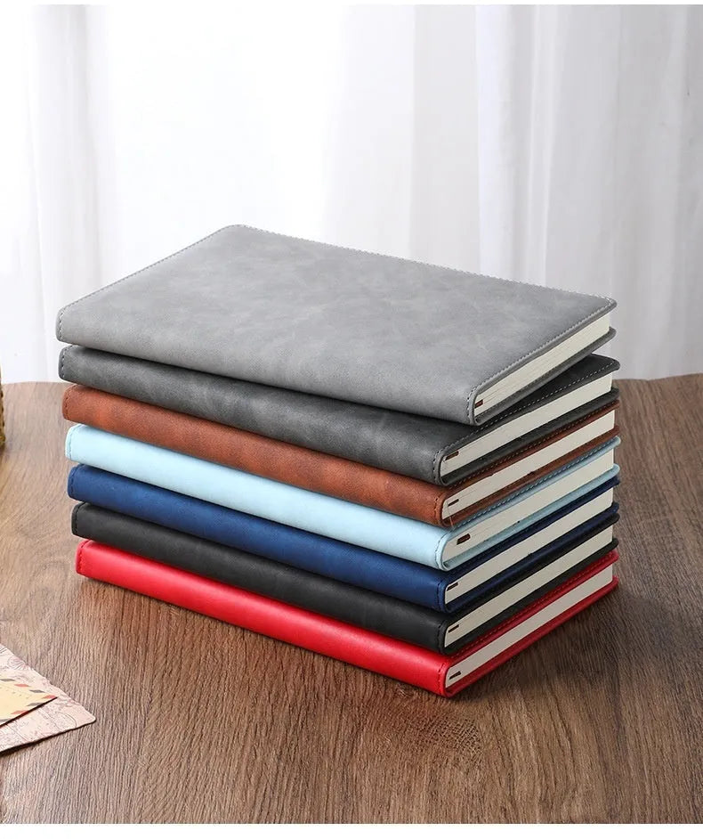 Custom A5 notebook with imitation leather cover in Business Black showing wood-free paper interior pages