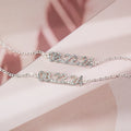 Stainless steel digital bracelet with crystal diamond accents on the numbers, shown in rose gold finish.