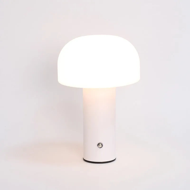 USB table lamp in black, green, orange, or white colours on a desk surface
