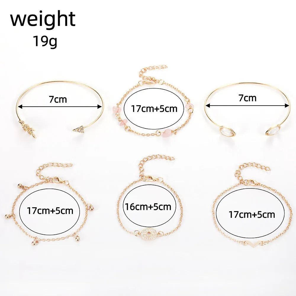 Gold-coloured women's bracelet set with six pieces showing spot drill arrow and water drop V-shaped charms