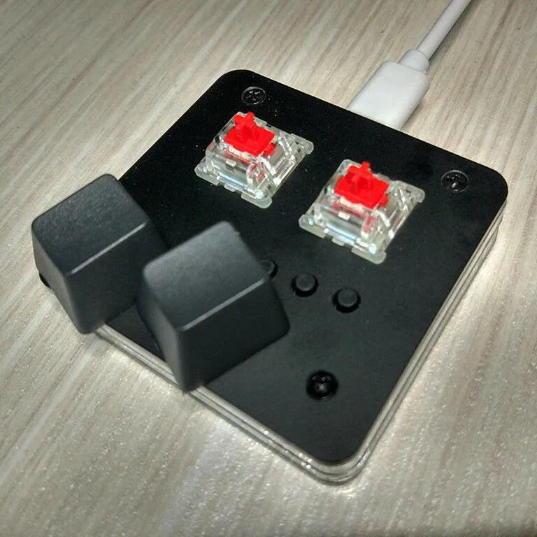 Mini USB keyboard with touch panel in black, grey, pink or white colours on white background