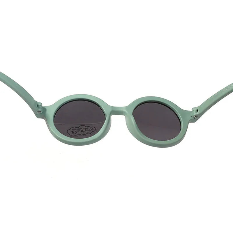 Children's silicone sunglasses with round frames for 0-3 year olds in multiple colour options showing UV400 and polarized protection