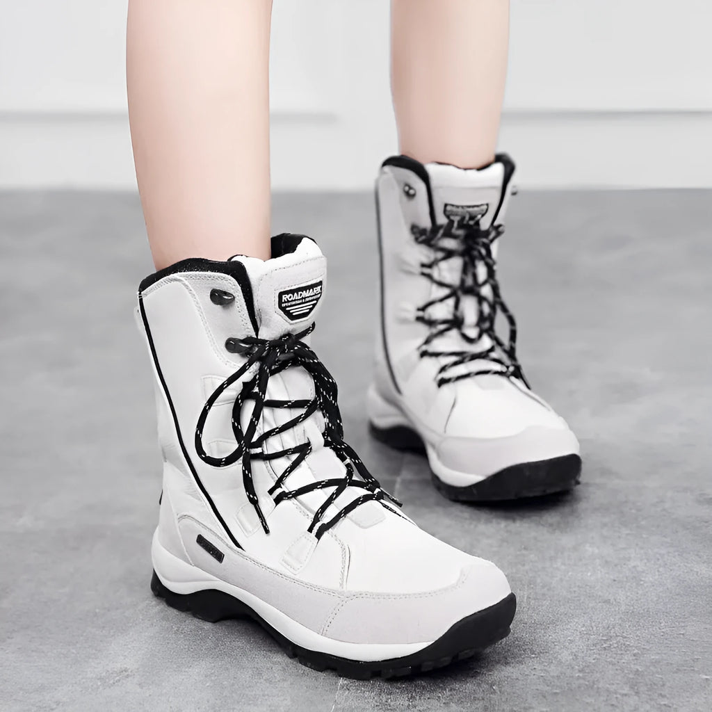 Women's genuine leather mid-calf thermal snow boots in black colour with round toe and rubber sole