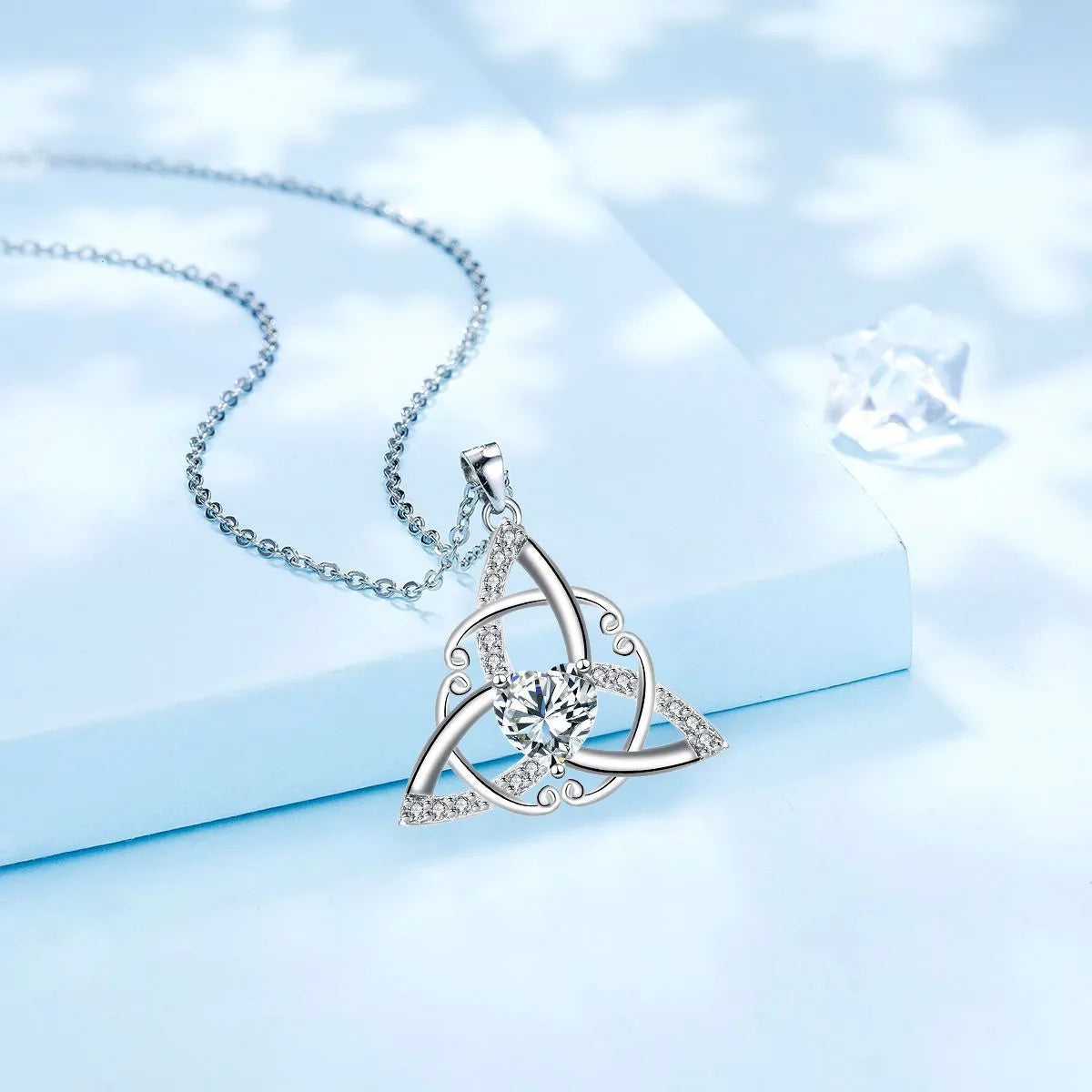 Women's Celtic knot necklace in copper with geometric pendant showing electroplated colour options