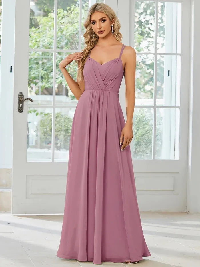 Women's sleeveless pleated A-line dress in light green with sling neckline for banquet occasions