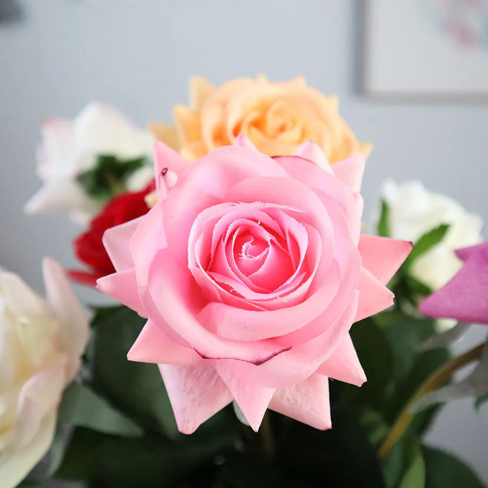 Silk fabric artificial rose bouquet in assorted colours with realistic petals, approximately 42cm long