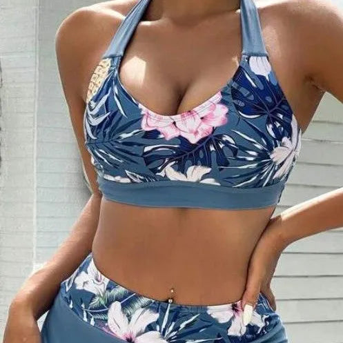 Women's blue solid colour lace-up bikini three-piece set with bra, skirt, and underwear on model