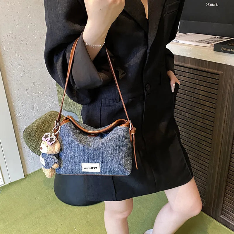 Fashion retro denim small crossbody bag in black with slit pocket and pendant