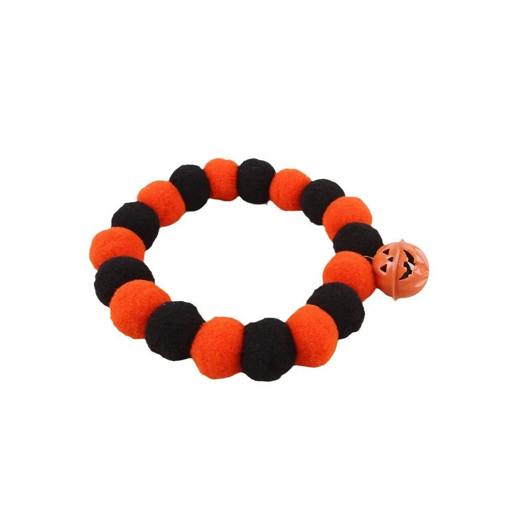Halloween cat collar with orange pumpkin design and trick or treat text for festive pet costumes