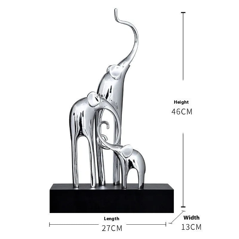 Detailed resin elephant figurine ornament in metallic gold finish on a wooden shelf.