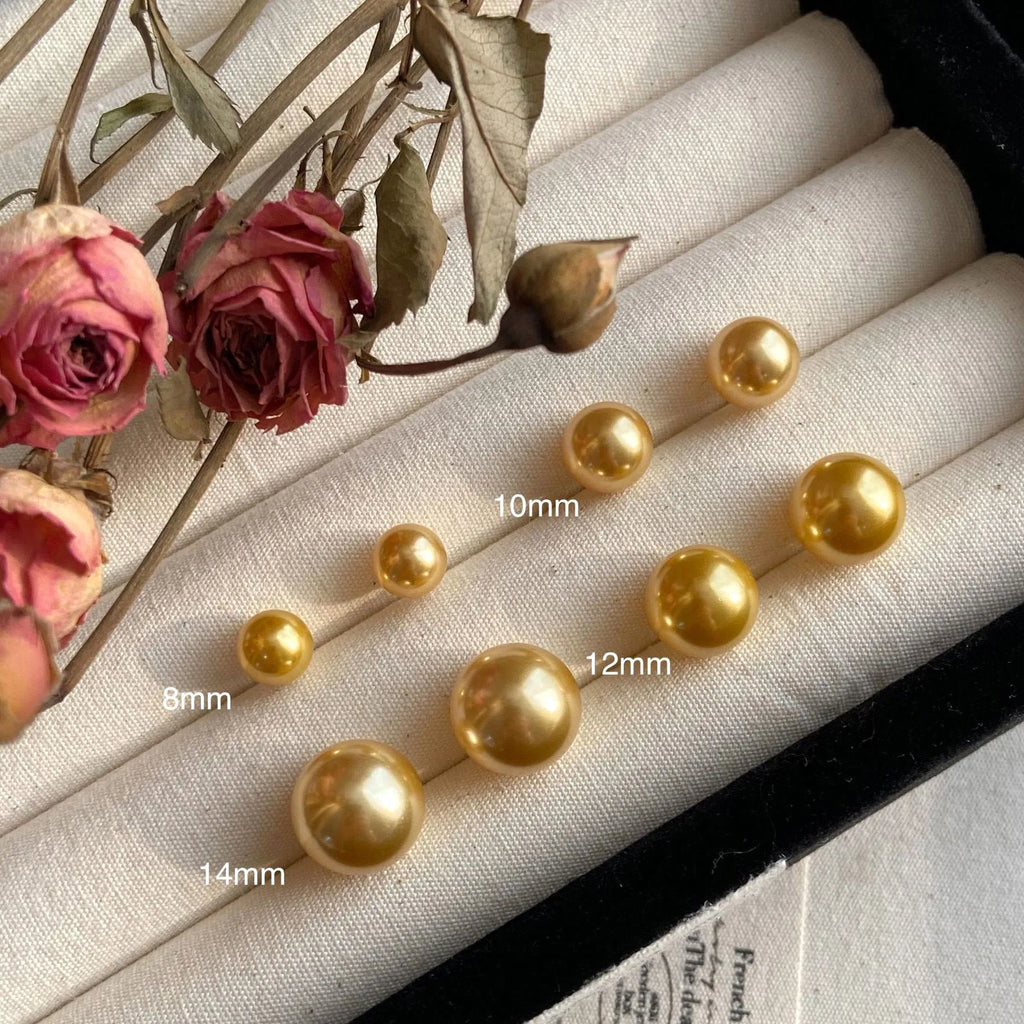 Large geometric pearl stud earrings with retro styling and eight-awm star detailing in silver