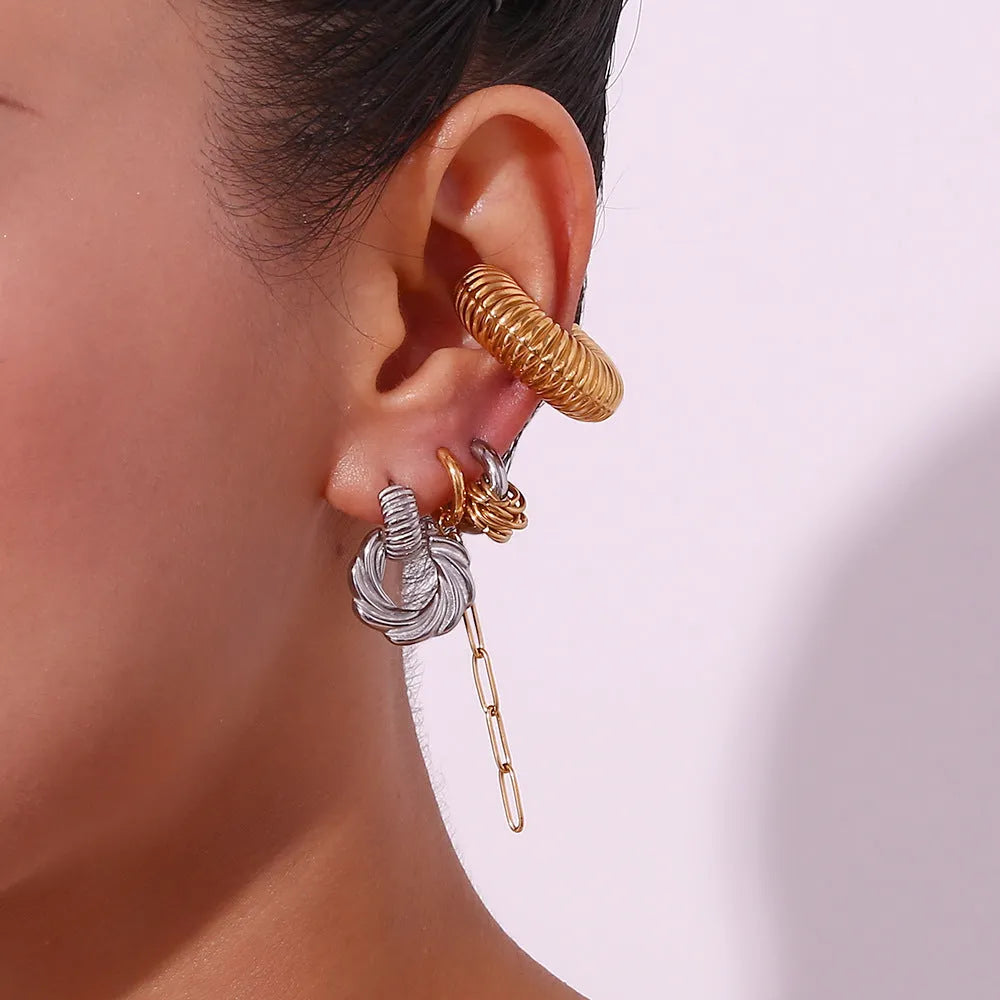 Stainless steel retro geometric oval stud earrings with electroplated finish on white background