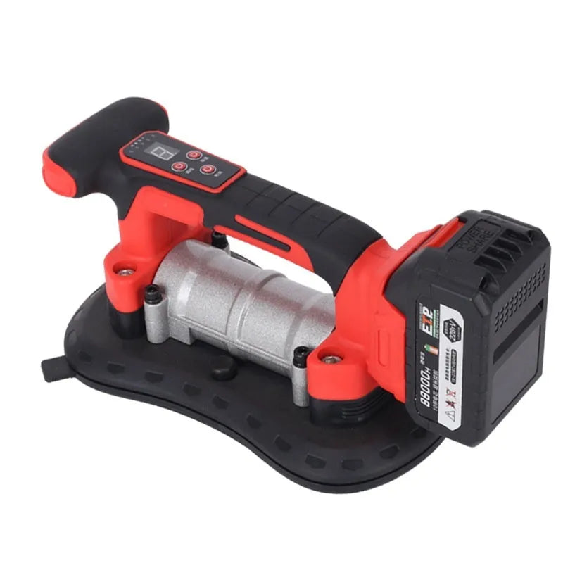 Cordless tile laying machine with digital display showing settings, placed next to ceramic tiles