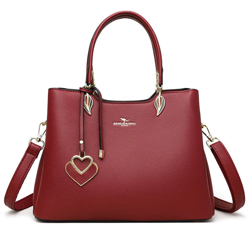 Women's black PU leather multi-compartment shoulder messenger bag with adjustable strap.
