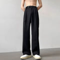 Thin straight leg black wide trousers with non-ironing finish and loose fit casual style