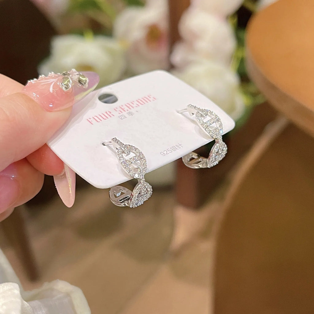 Ladies casual earrings with diamond-effect design in silver, gold, or rose gold metallic finishes