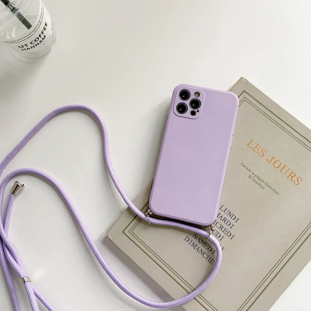 Liquid silicone phone case with crossbody lanyard for iPhone 13 Pro in black, showing rear cover and attached strap