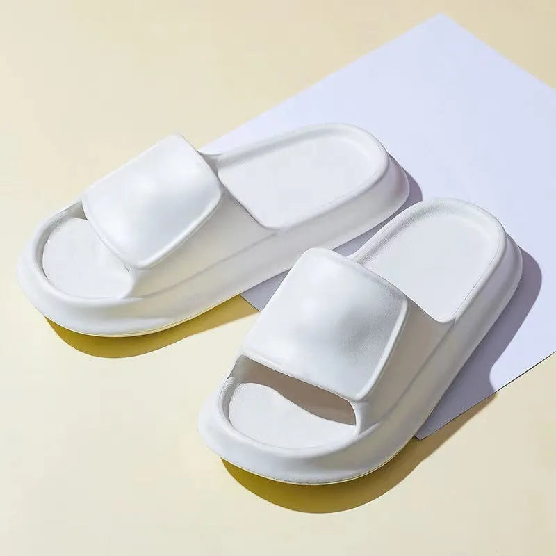 Soft EVA flip-flop slippers with thick sole in multiple colours on a white background.