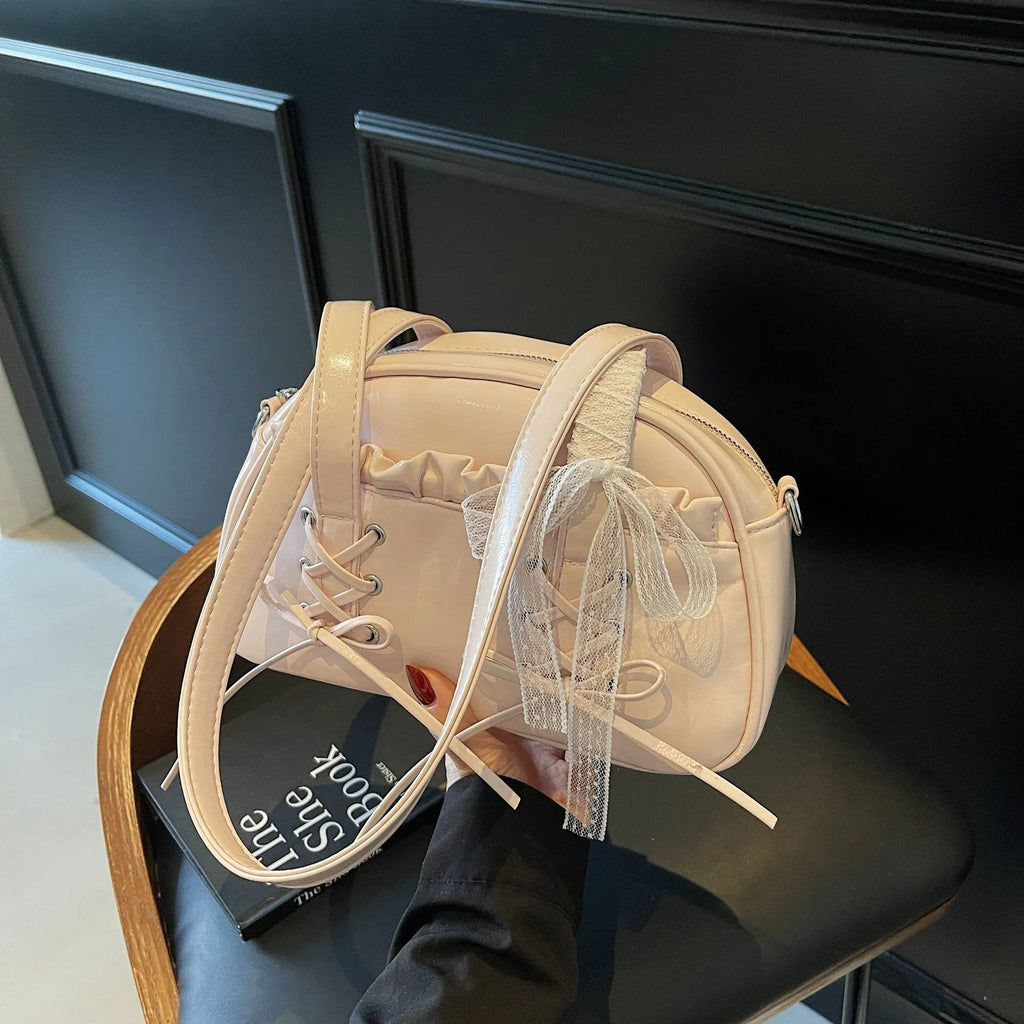 Women's casual bandage bow handbag in PU with shoulder strap and sewing thread detailing.