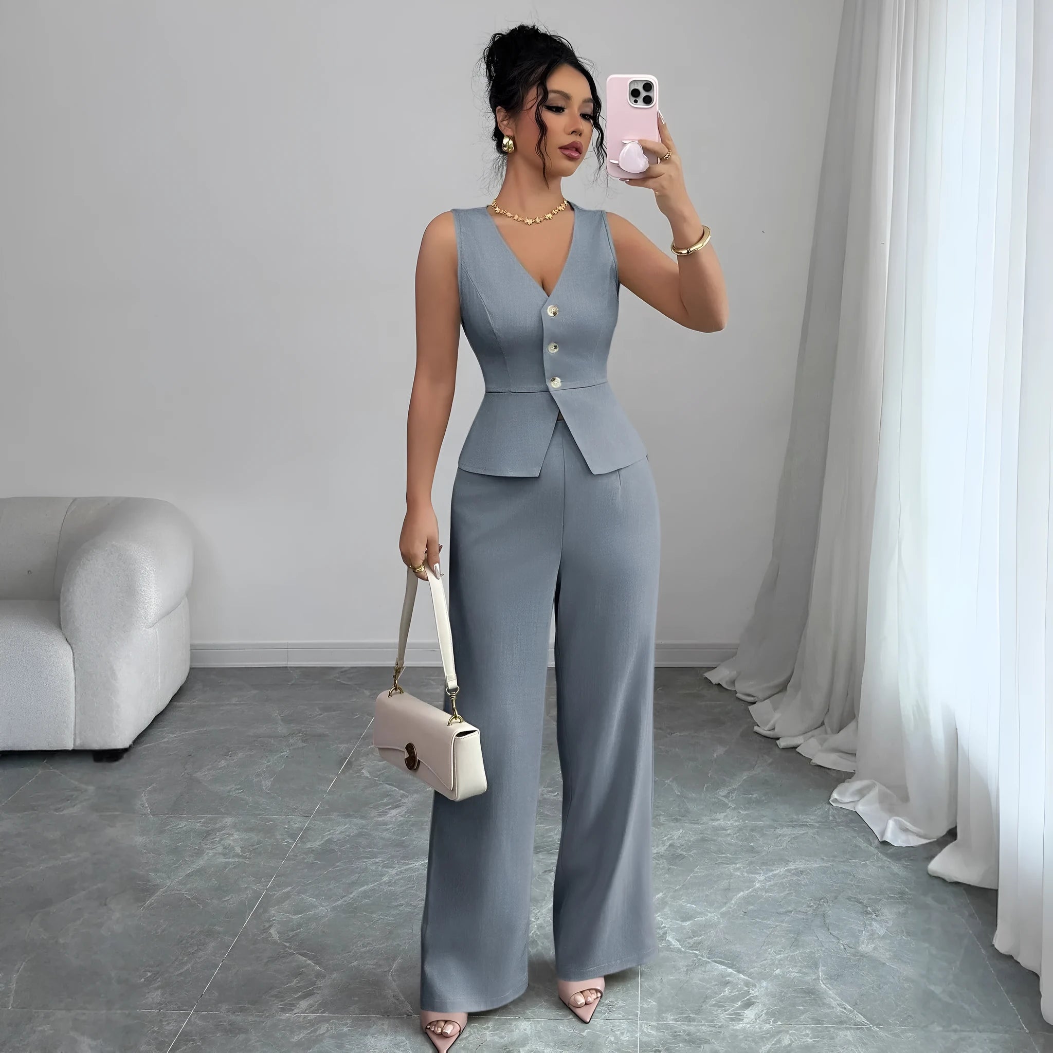 Women's solid colour sleeveless vest and high-waist trouser two-piece set in a casual style.