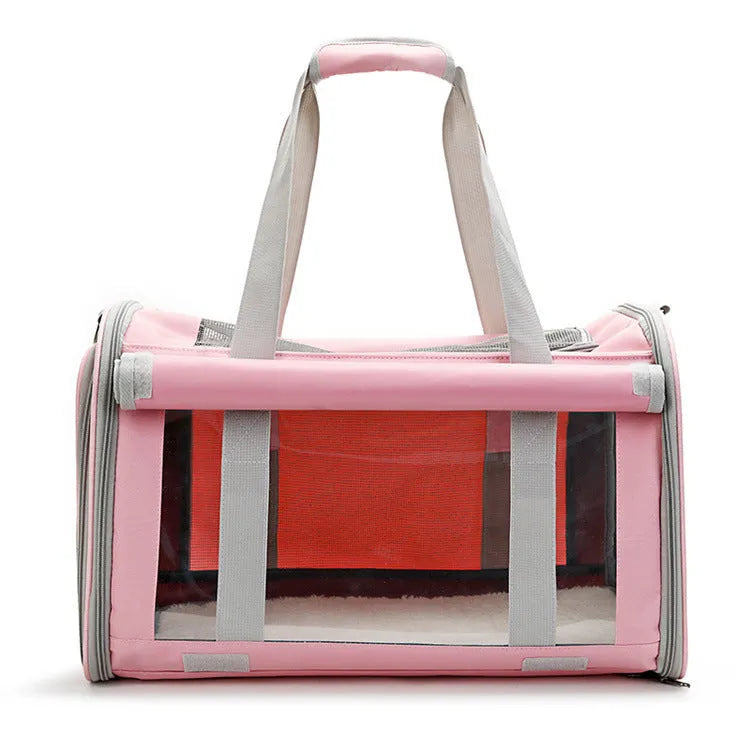 Outdoor portable pet bag in black with transparent panels and mesh sides, folded and shown next to a cat