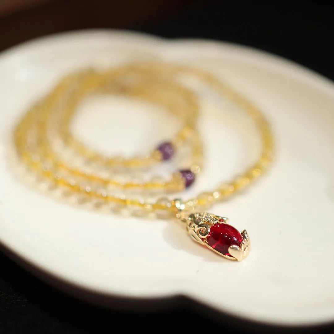 Handmade gold rutilated quartz bracelet with Chinese style hanging chopsticks and ruby quartz charm