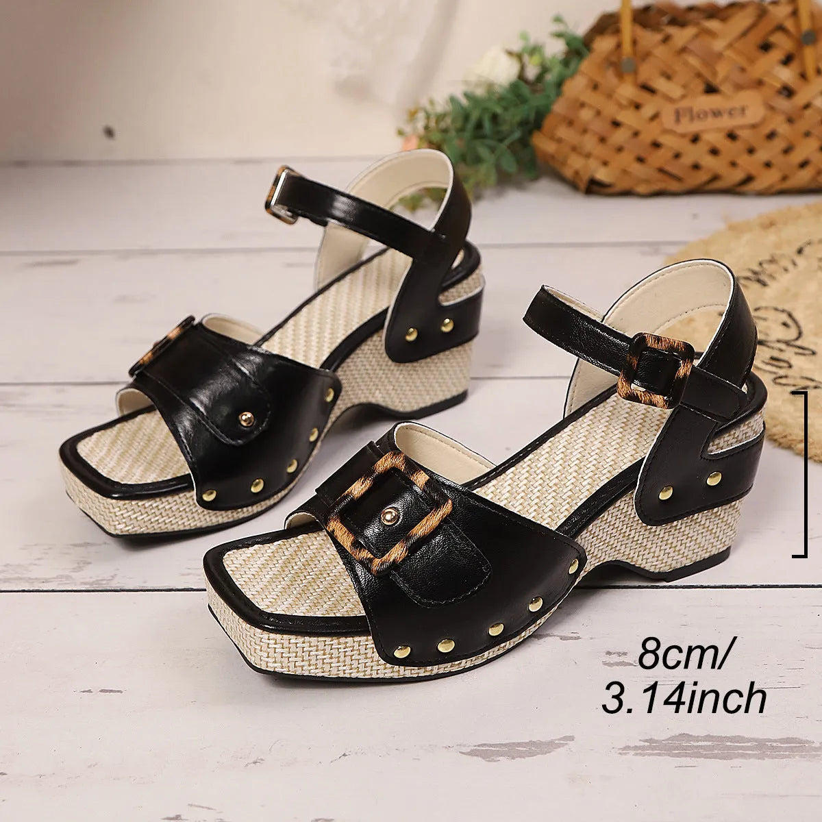 Women's white chunky heel sandals with a metal buckle and square-toe design on a rubber sole.