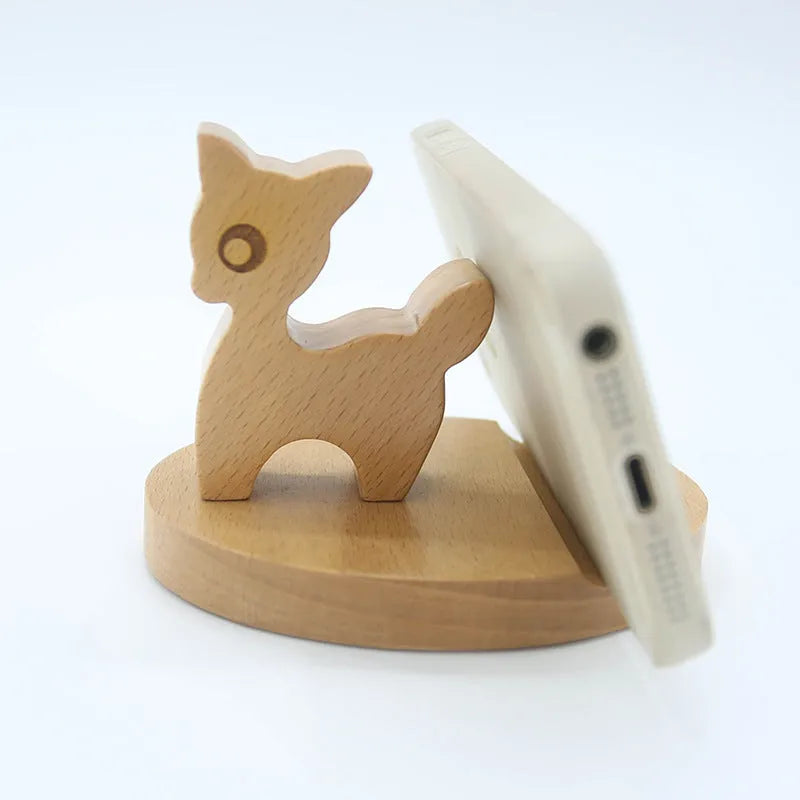 Beech wood mobile phone holder stand with coin slot and decorative carving.