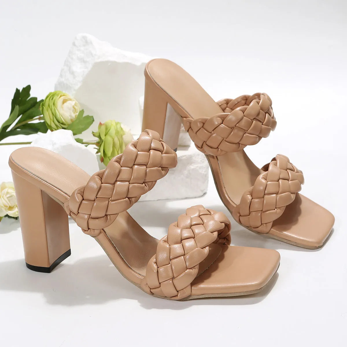 Women's apricot square toe flip flops with chunky heel and woven twisted design on a white background.
