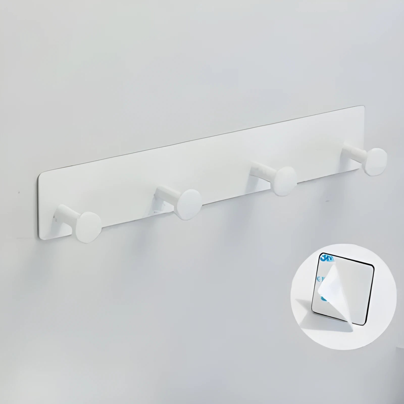 Iron adhesive wall hook with multiple arms on shower door, white double-sided tape visible