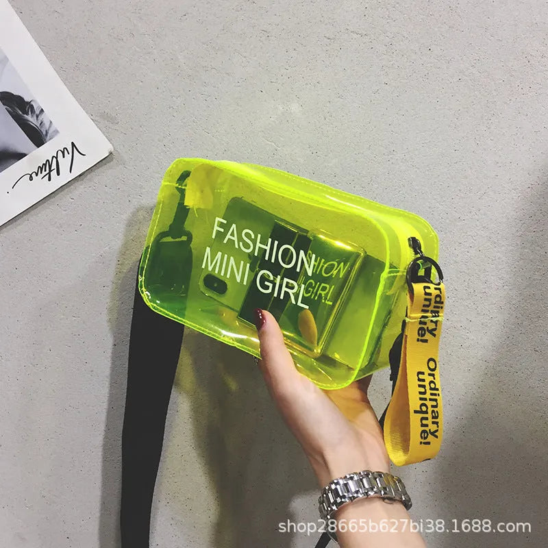 Transparent square women's shoulder bag in jelly material with a diagonal cross strap, showing internal mobile phone pocket.