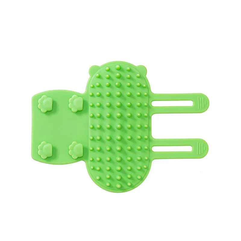 Silicone cat hair removal massage comb attached to a wall corner with rounded teeth for grooming
