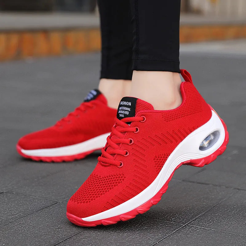 Women's red and black mesh sneakers with round toe and front lace-up design