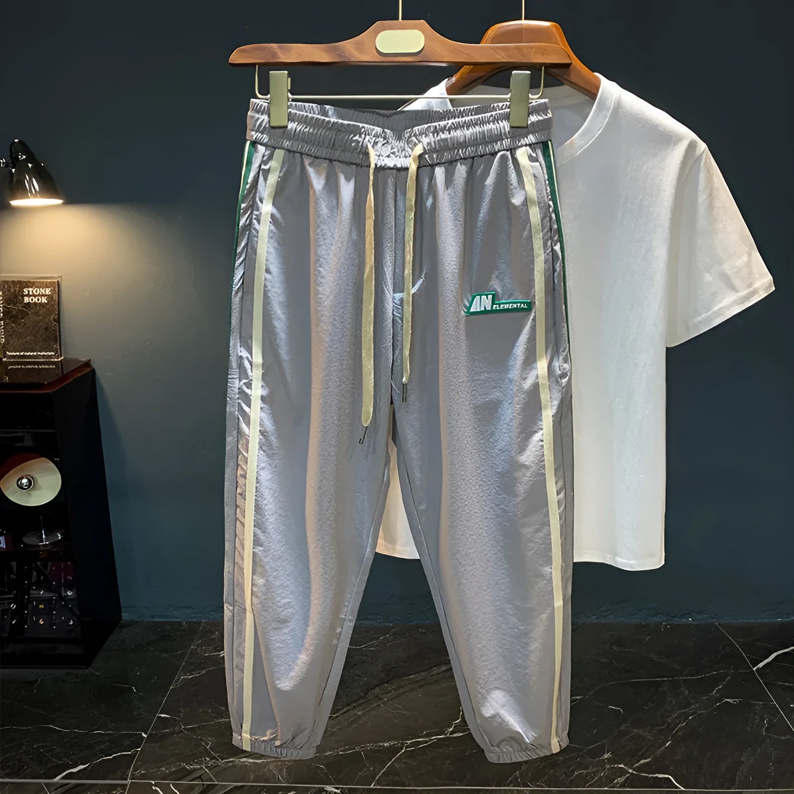Men's solid colour cotton harem pants in black or grey, showing mid-waist and straight leg design