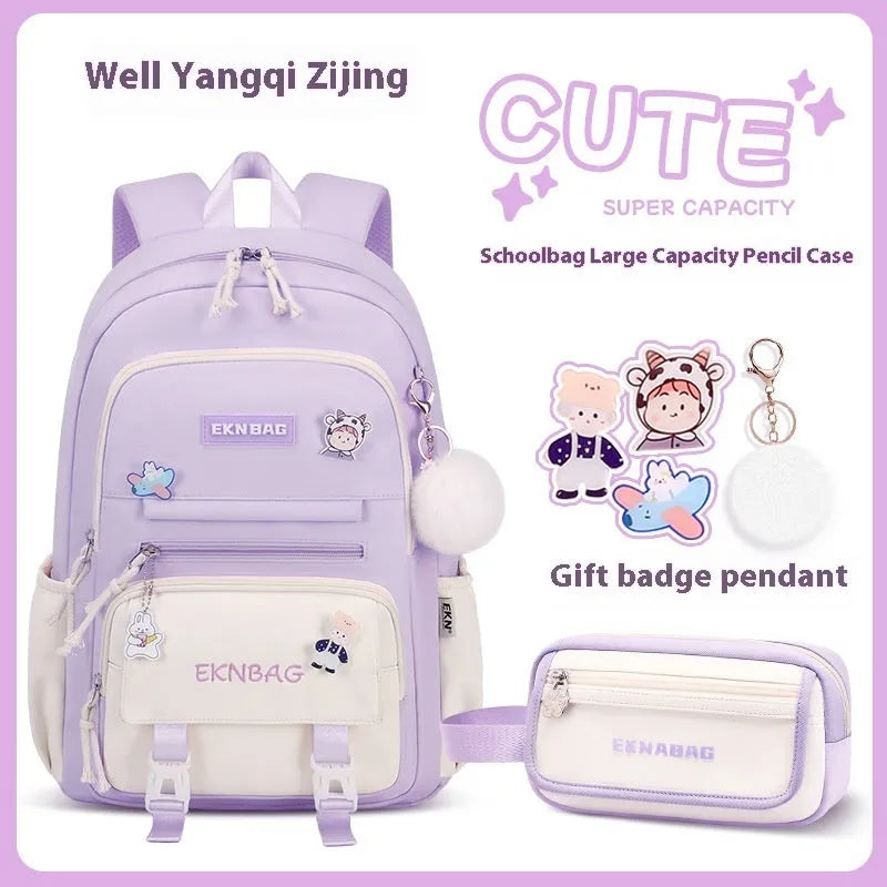 Pink waterproof Oxford cloth school backpack for girls with curved shoulder straps on a white background.