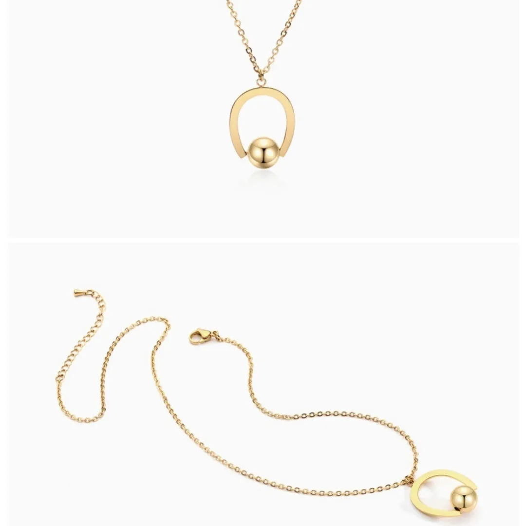 Stainless steel necklace with geometric pendant on adjustable cross chain in gold or silver finish