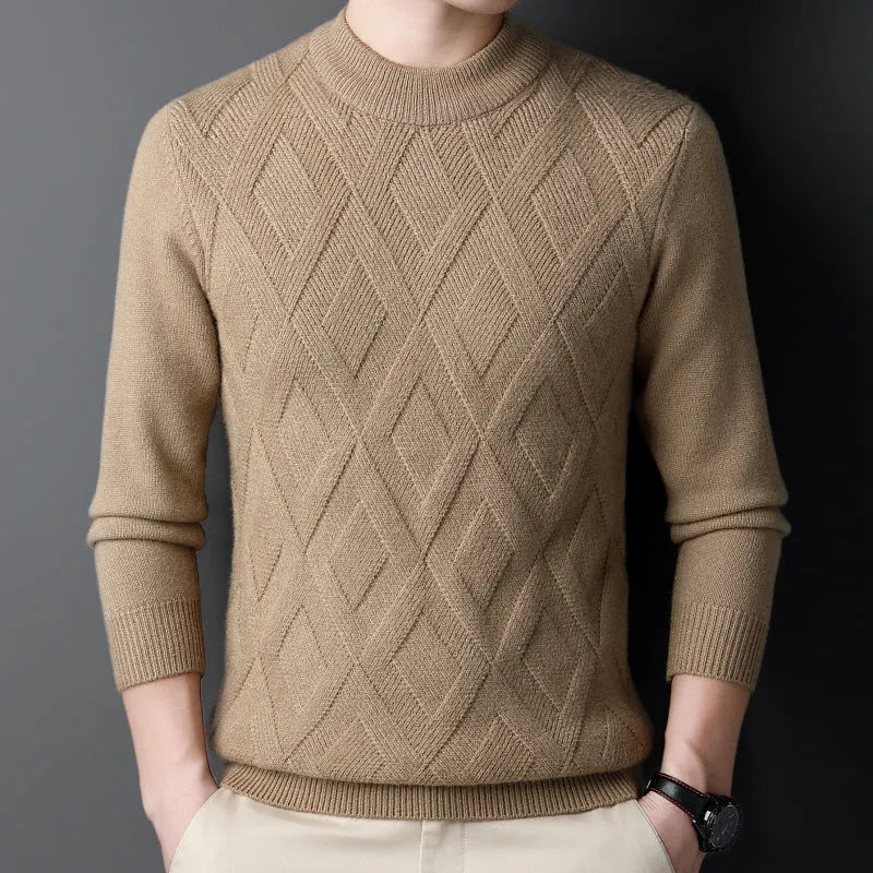 Man wearing a thick grey diamond jacquard knit pullover sweater.
