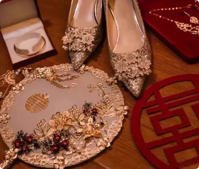Champagne coloured pointed toe bridal heels with rhinestone patterns on a fine heel.
