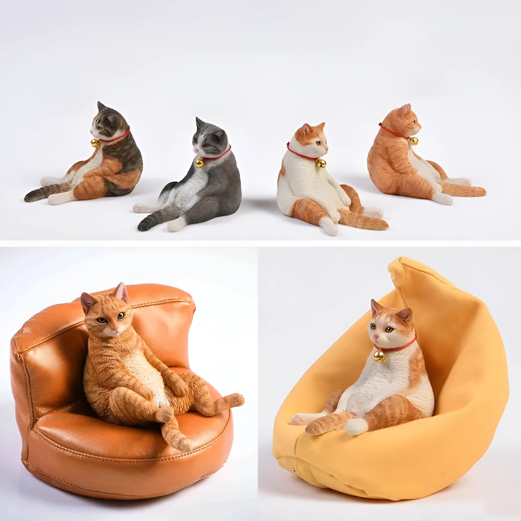 Small lazy cat car ornament and sofa, 7.5cm tall resin model on a car dashboard.