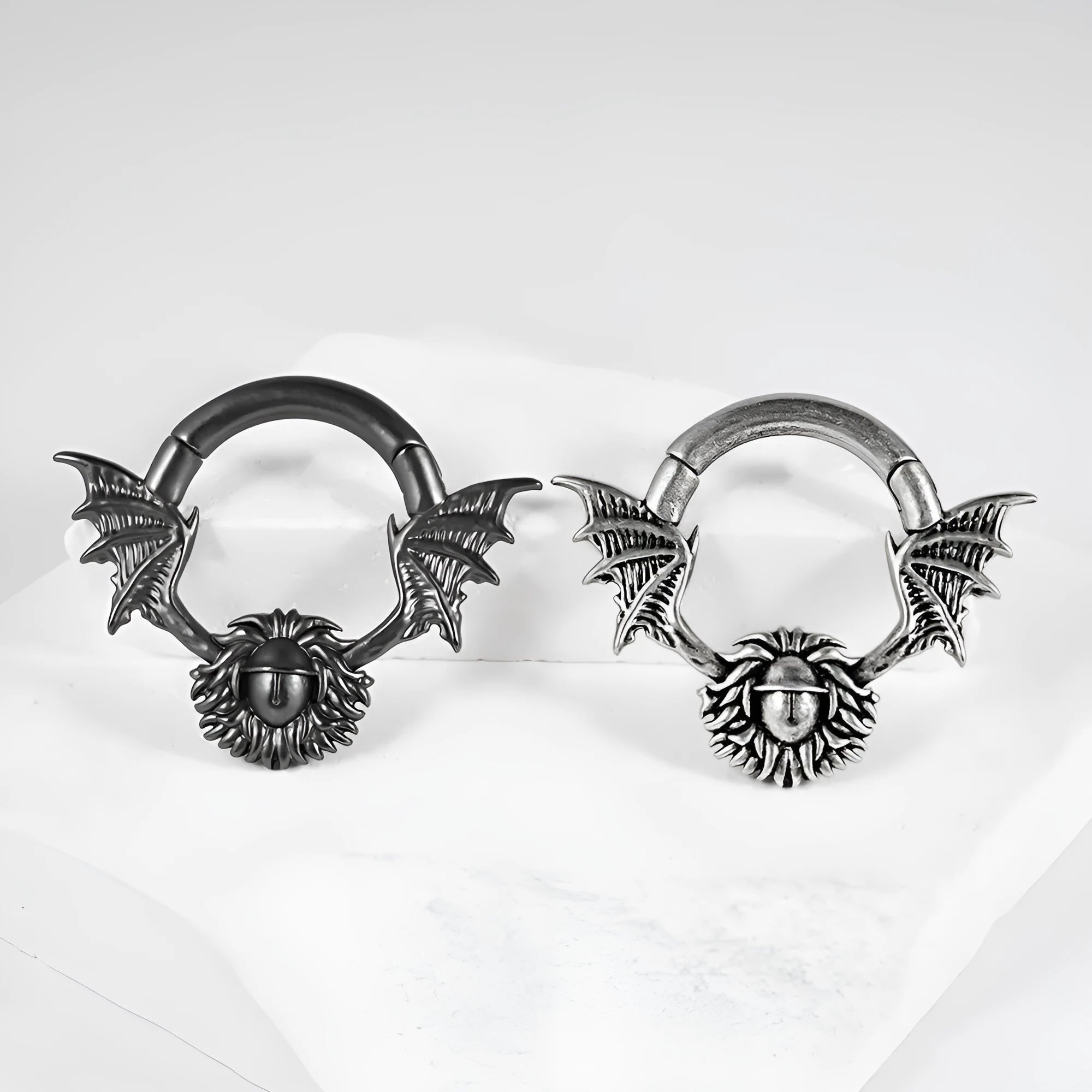A pair of geometric cone and round shaped copper ear cuffs with magnetic clip-on fasteners.