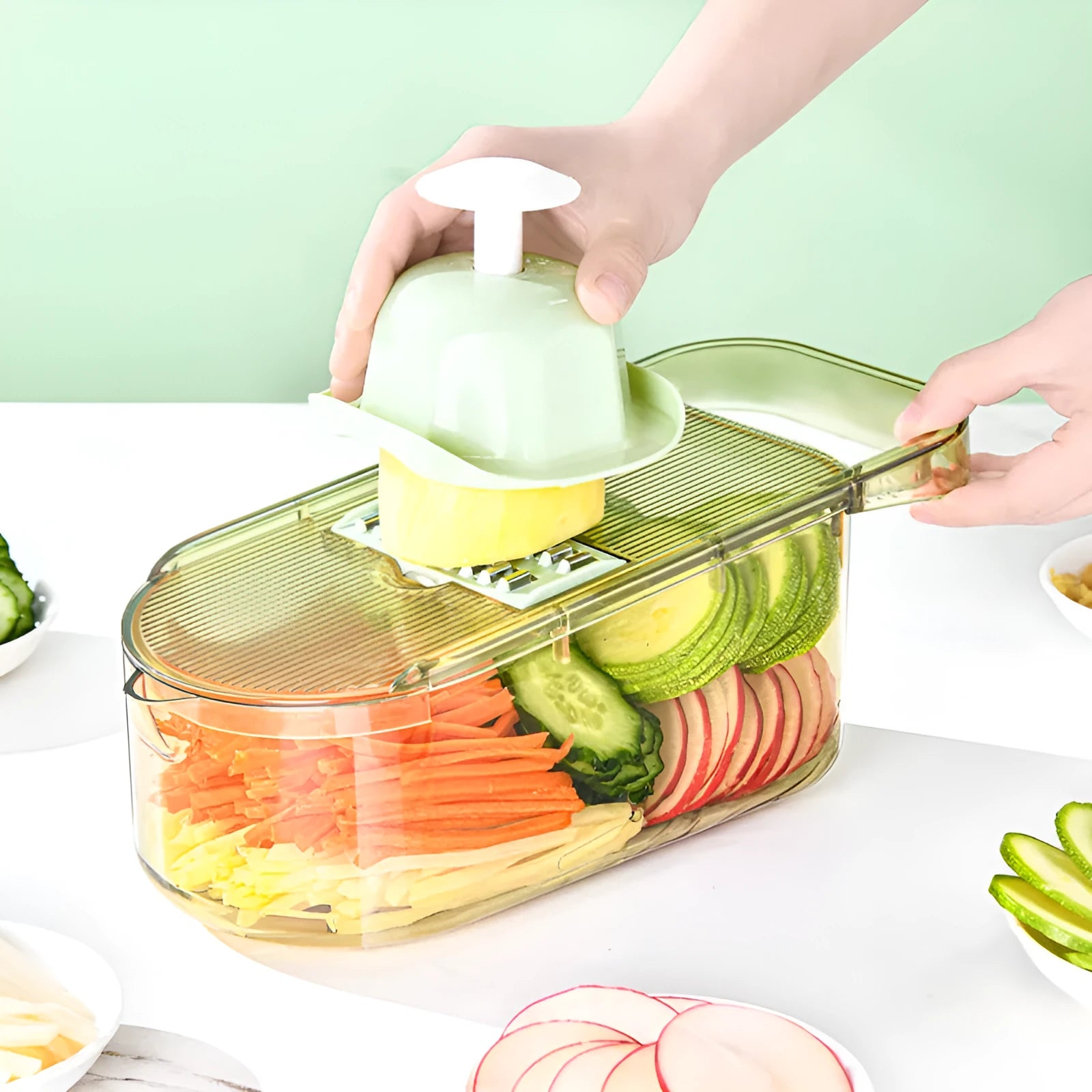 Transparent green vegetable cutter with stainless steel blades and optional drain basket