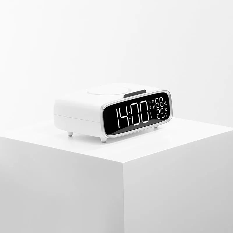 White ABS acrylic Bluetooth speaker wireless charging night lamp on a surface.