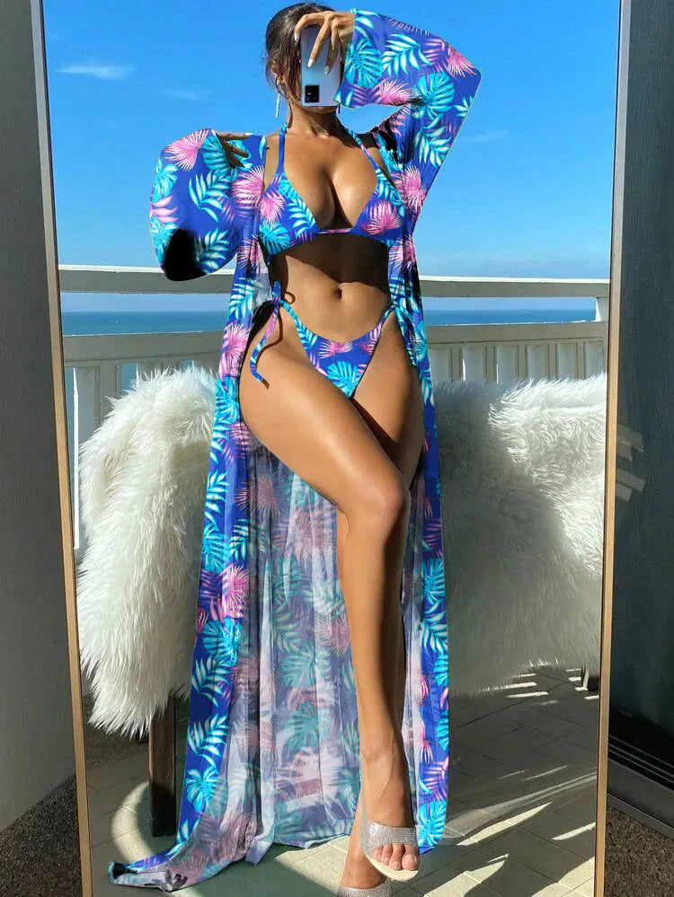 Women's long sleeve bikini set with floral pattern and matching robe on a hanger.