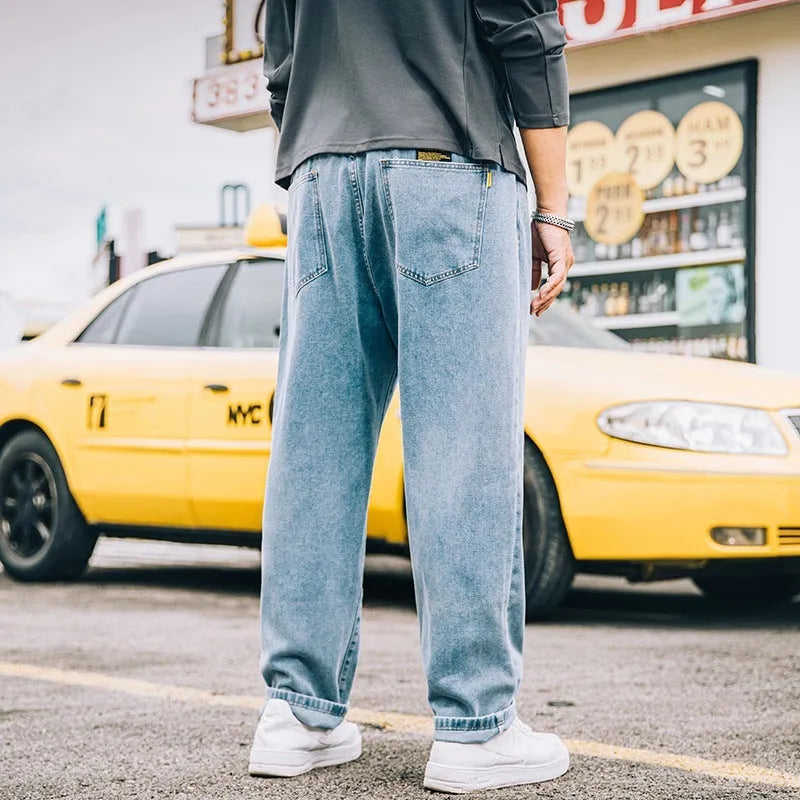 Men's loose straight casual jeans in dark blue with mid-waist fit and zipper fly