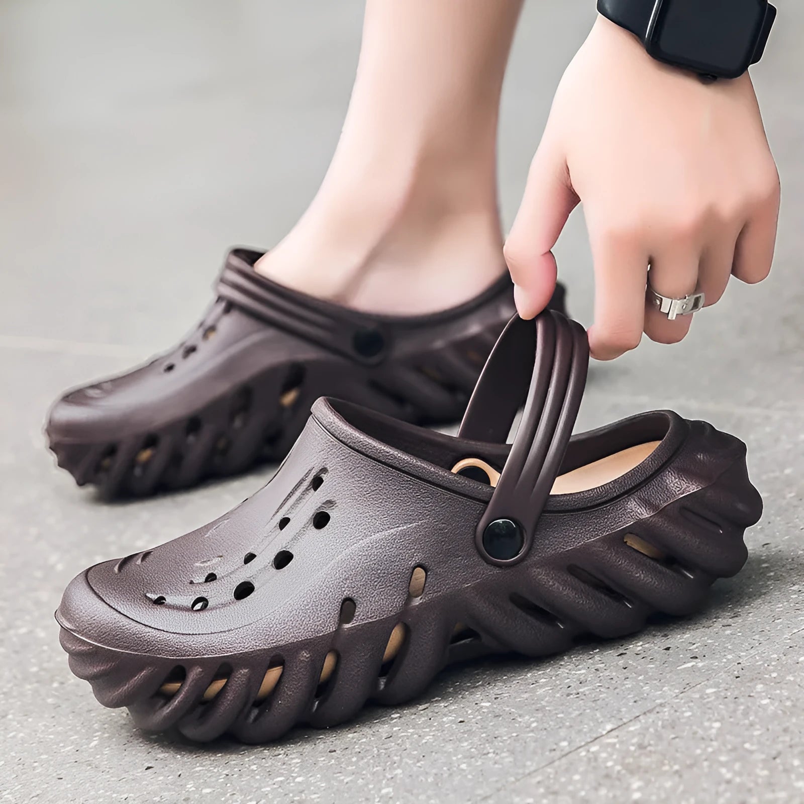 Men's beige EVA slipper sandals with hollow-out design and non-slip sole, shown from the side.
