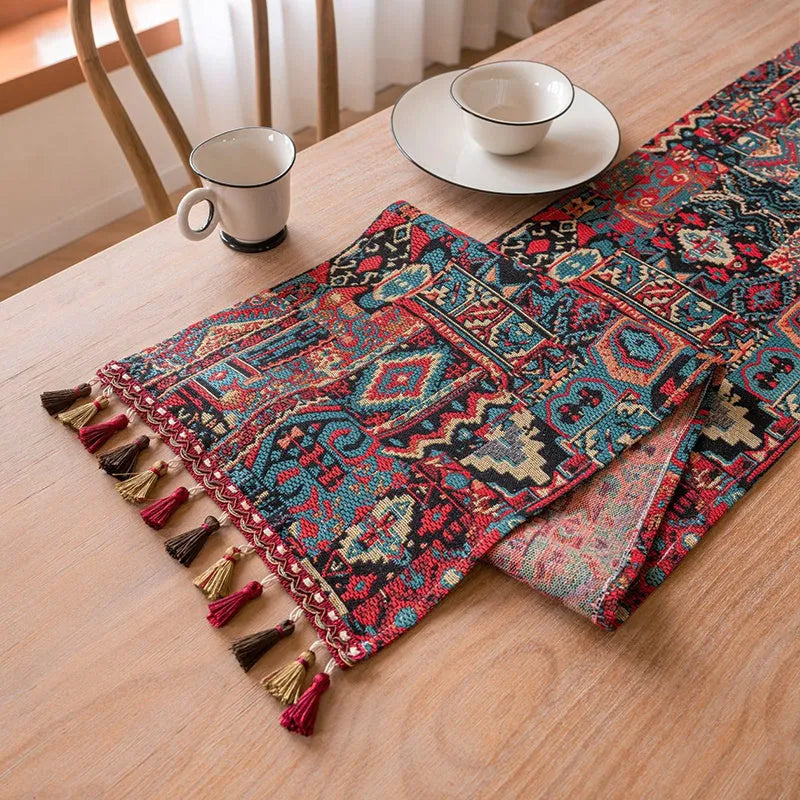 Dark blue Nordic jacquard table runner with bouquet pattern and tassel fringe on wooden table