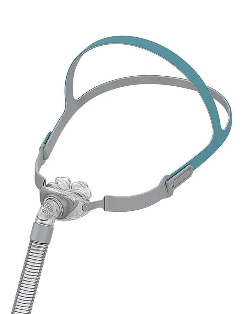 Ventilator nasal pillow mask accessory kit with silicone cushions and plastic headband.