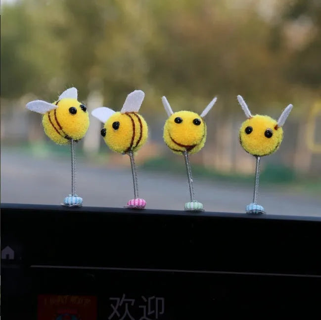 Soft fur ball bee car decoration measuring 3x3 centimetres with cartoon design