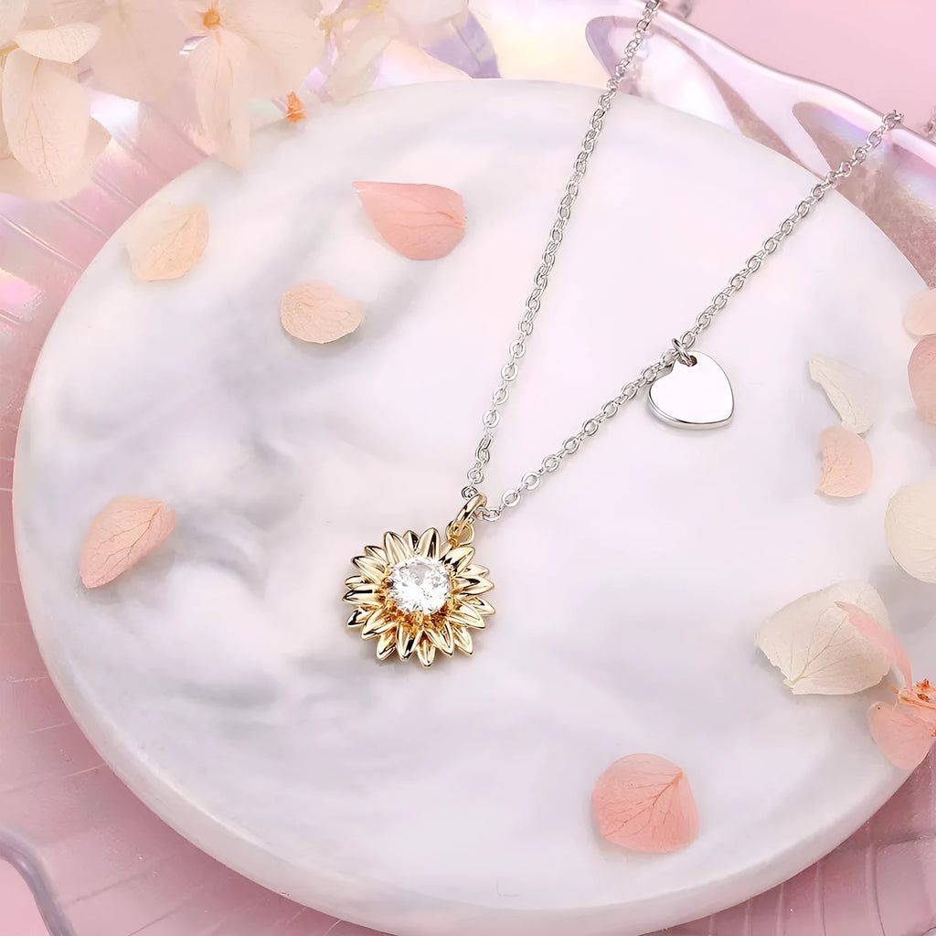 Women's 925 sterling silver sunflower necklace with daisy petal pendant on an adjustable cross chain.